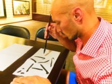 Rob Taylor drawing Chinese Characters at art gallery 1