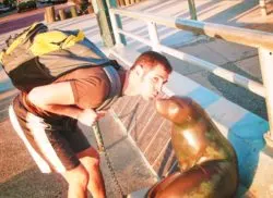 Chris Taylor kissing seal statue at Seal Beach Orange County 1