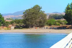 Cove and kayaks from pier at Hearst San Simeon California State Park 1