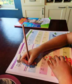 Taylor Family doing Math workbooks WorldSchooling 7