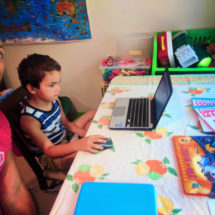 Taylor Family doing writing workbooks WorldSchooling 2
