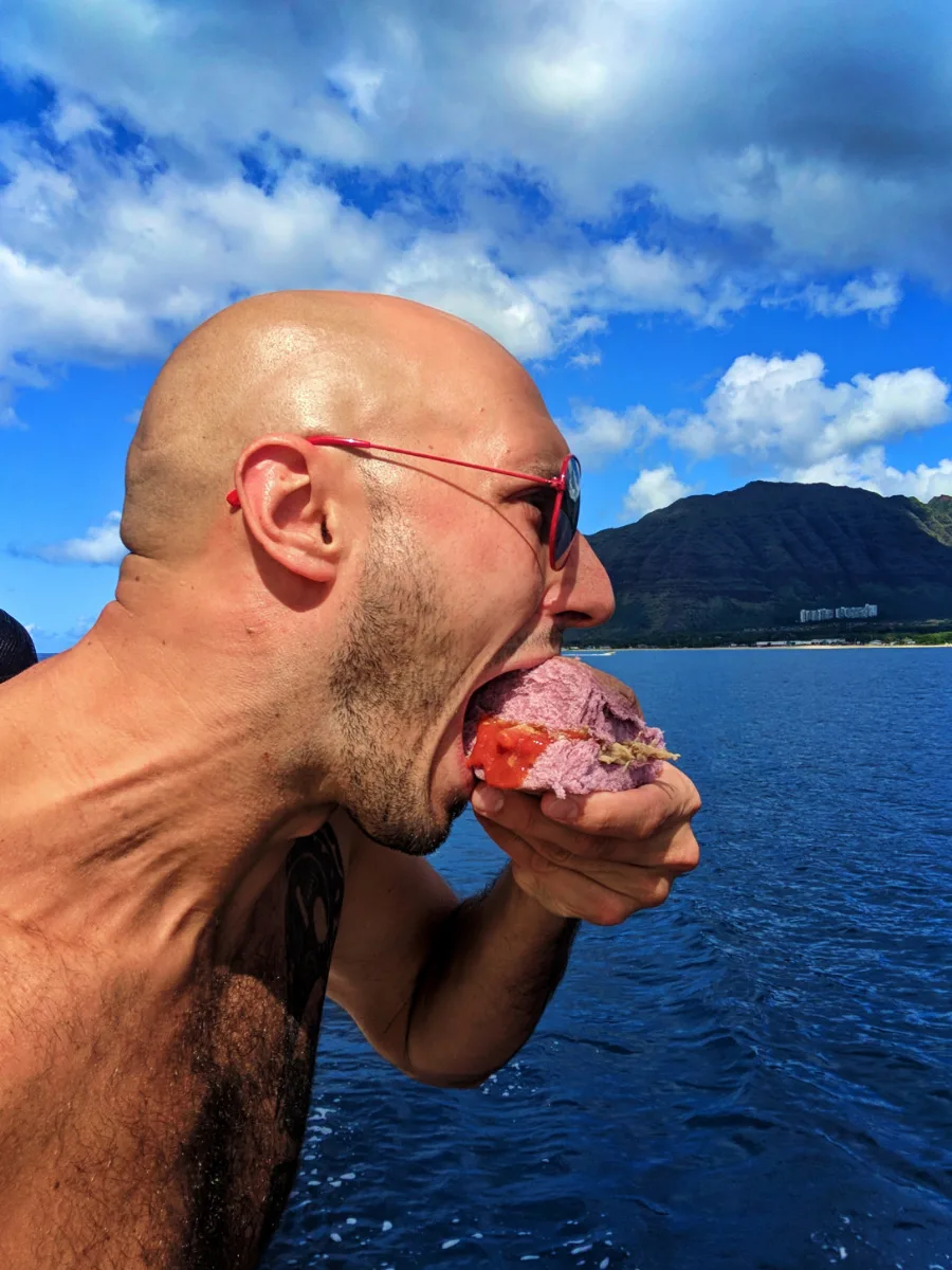 Taylor family eating kaluha pork on poi on catamaran off Oahu 3