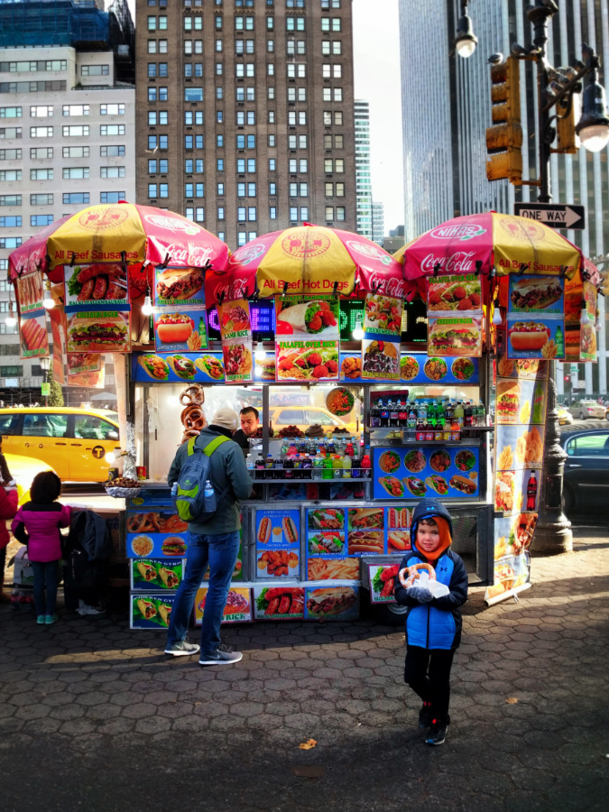 Taylor Family eating pretzels in Uptown Manhattan Pretzel cart 2