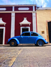 VW Bug and Colorful buildings on sidestreet in Valladolid Yucatan road trip 2d