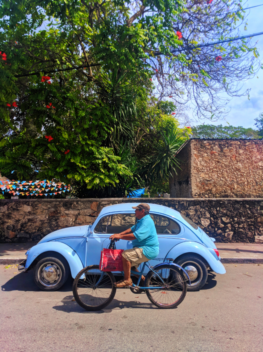 VW Bug and Colorful buildings on sidestreet in Valladolid Yucatan road trip 14