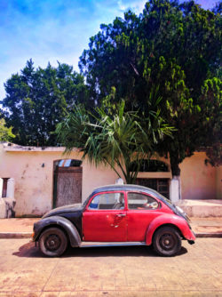 VW Bug and Colorful buildings on sidestreet in Valladolid Yucatan road trip 7