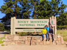 Taylor Family at Entrance Sign Rocky Mountain National Park Colorado 2