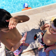 Taylor Family with sunblock by pool at Universal Cabana Bay Resort Orlando Florida 1