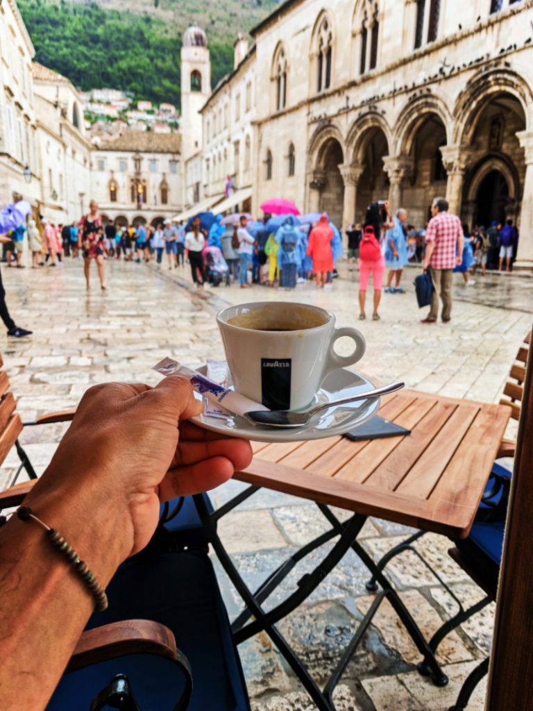 Drinking coffee in the rain Old Town Dubrovnik Croatia 1