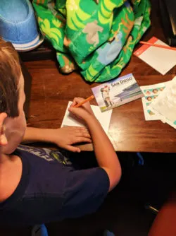 Taylor Family writing postcards at Hotel Indigo San Diego Gaslamp 1