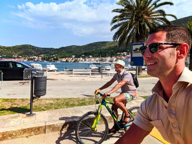 Chris and Rob Taylor riding bikes around cove in Vis Croatia 5