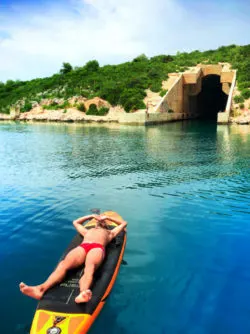 Rob Taylor on paddleboard at submarine silo Pride Sailing Holidays at Vis Croatia 1