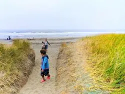 Taylor Family crossing sand dunes at Westport Light State Park Westport Washington Coast 2