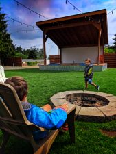 Taylor-Family-in-amphitheater-Area-at-LOGE-Camps-Resort-Westport-Washington-1-169x225.jpg