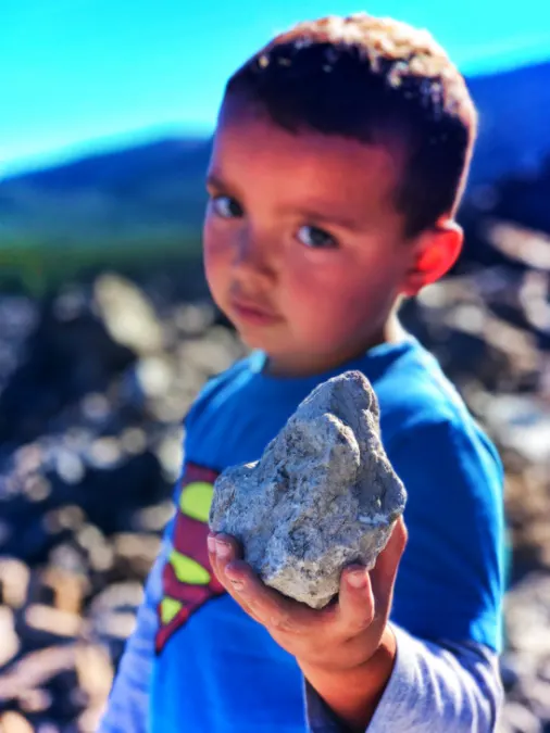 Elliott Taylor holding pumice rock at Big Obsidian Flow Newberry Caldera Bend Oregon 1
