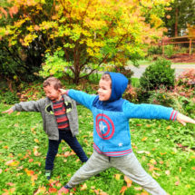 Taylor family with fall colors doing yoga Suquamish 2