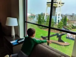 Taylor Family and Space Needle through living room windows at Hyatt House Seattle 1