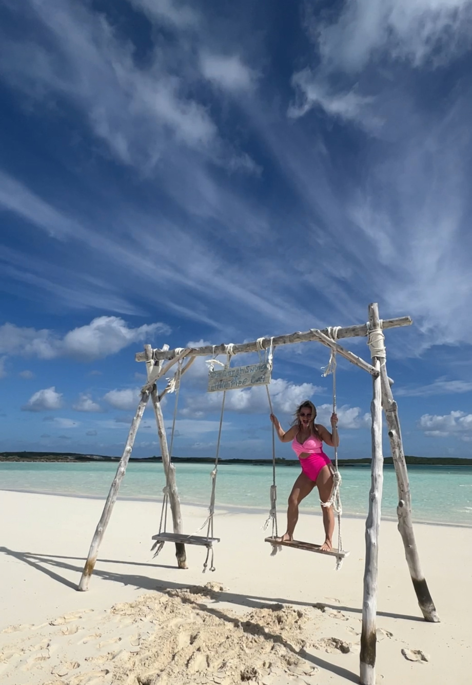 Angie on beach swing in Bahamas