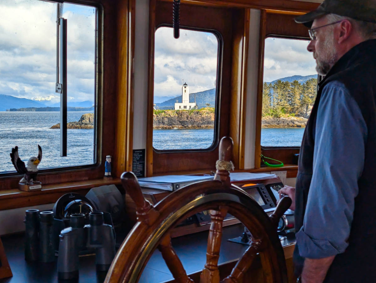Captain Jim with Five Finger Lighthouse from Mist Cove sailing with the Boat Company in Southeast Alaska 2