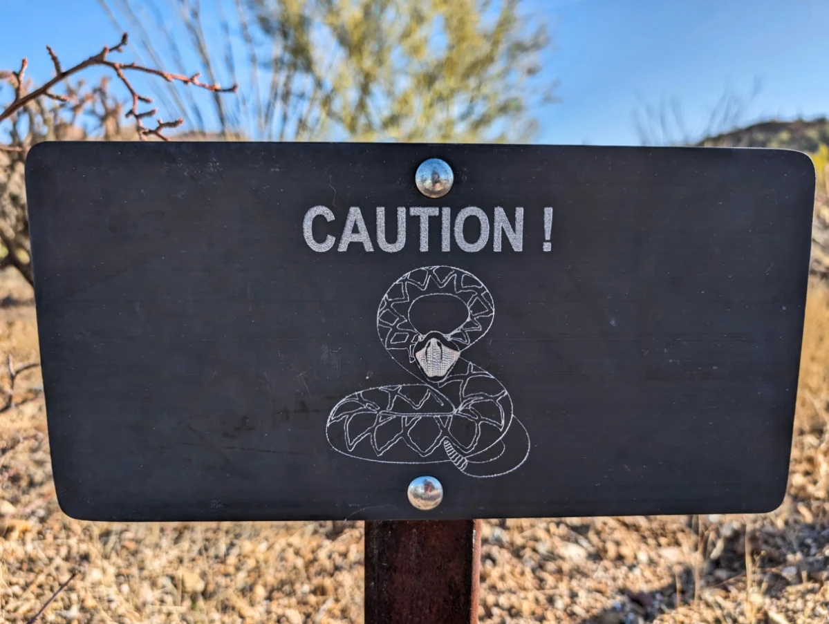 Caution Rattlesnakes sign at Tucson Mountain District Saguaro National Park Arizona 1