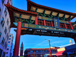 Chinatown Gate with King Street Station tower Chinatown Seattle 1