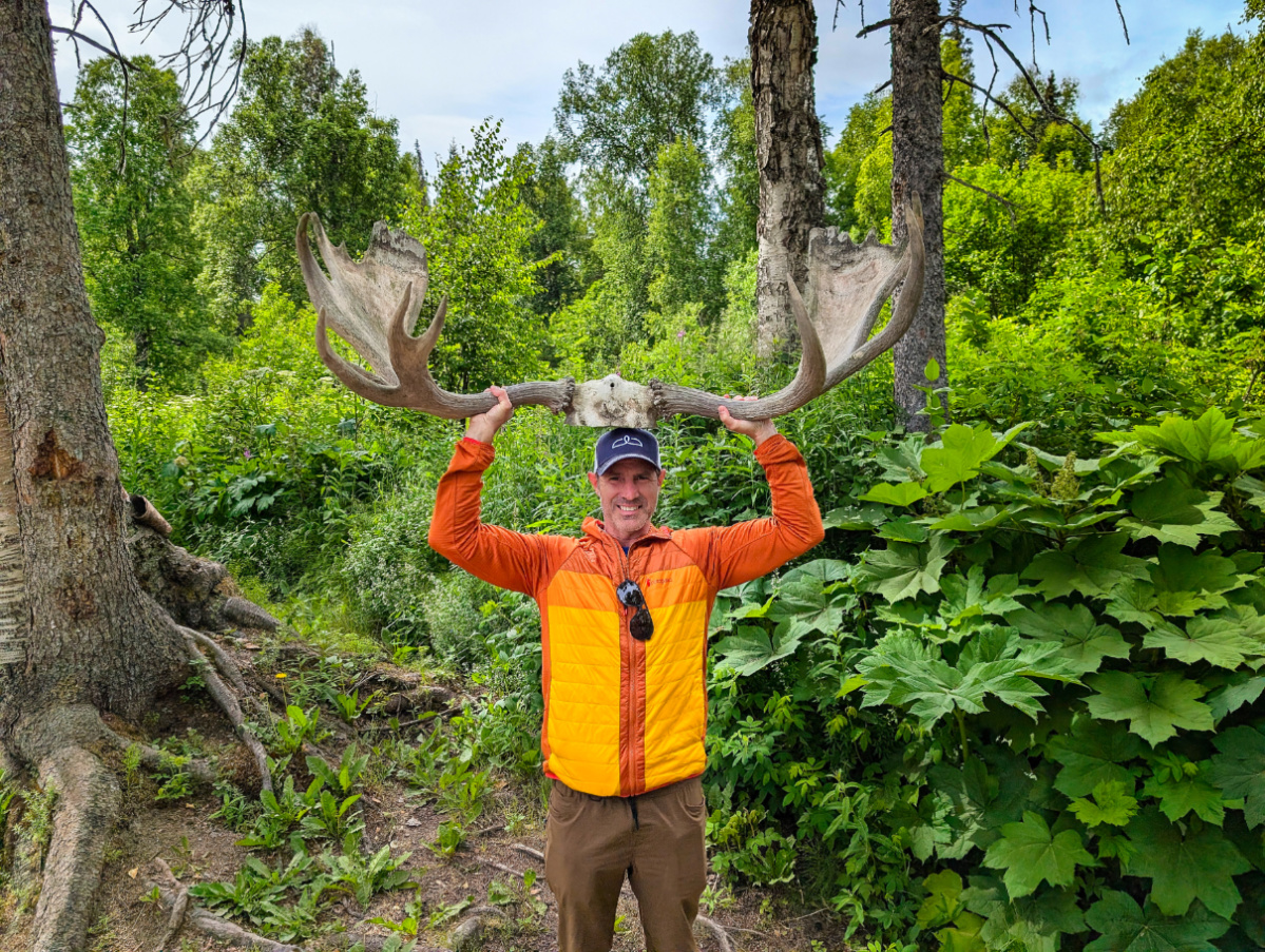 Chris Taylor Holding Moose Antlers on Susitna River Jet Boat Tour Talkeetna Alaska 2