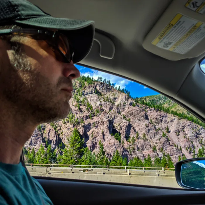 Chris Taylor driving past rocky cliffs rural Montana 1