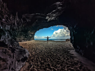 Chris-Taylor-in-sea-cave-at-Hanakapiai-Beach-Na-Pali-Coast-Kalalau-Trail-Haena-State-Park-Kauai-Hawaii-1-320x240.jpg