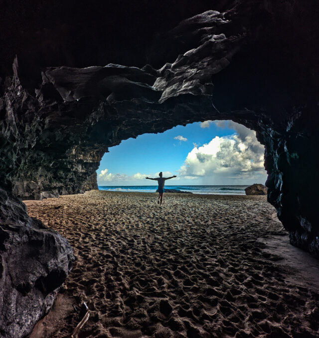 Chris Taylor in sea cave at Hanakapi`ai Beach Na Pali Coast Kalalau Trail Haena State Park Kauai Hawaii 1
