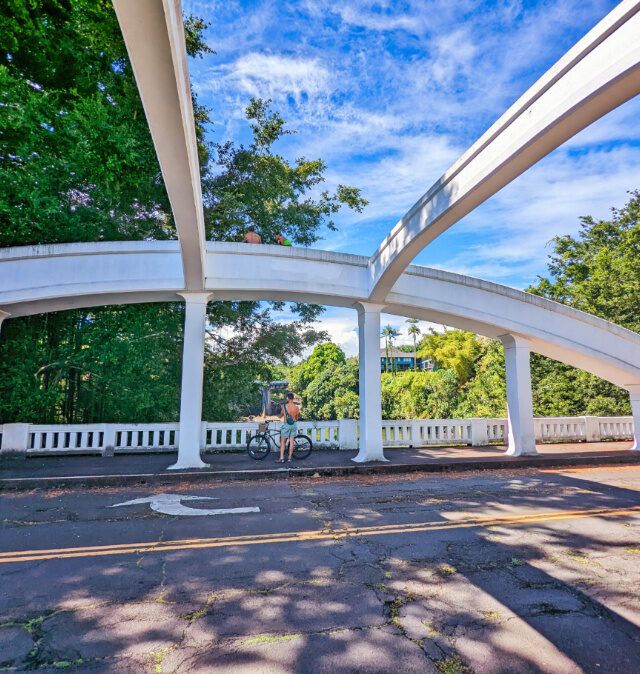 Chris Taylor riding bikes on Rainbow Bridge Hilo Big Island Hawaii 1