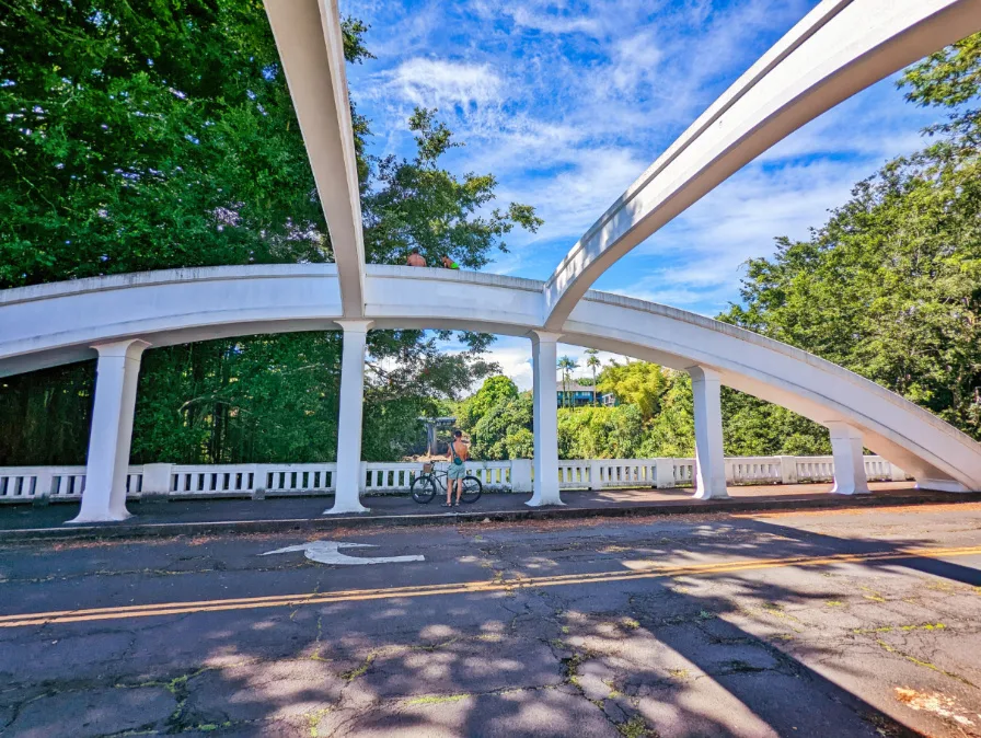 Chris Taylor riding bikes on Rainbow Bridge Hilo Big Island Hawaii 1