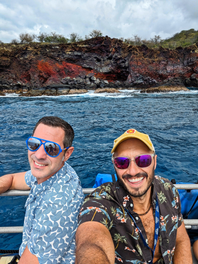 Chris and Rob Taylor on skiff at lava sea cliffs with UnCruise Safari Explorer Big Island Hawaii 1