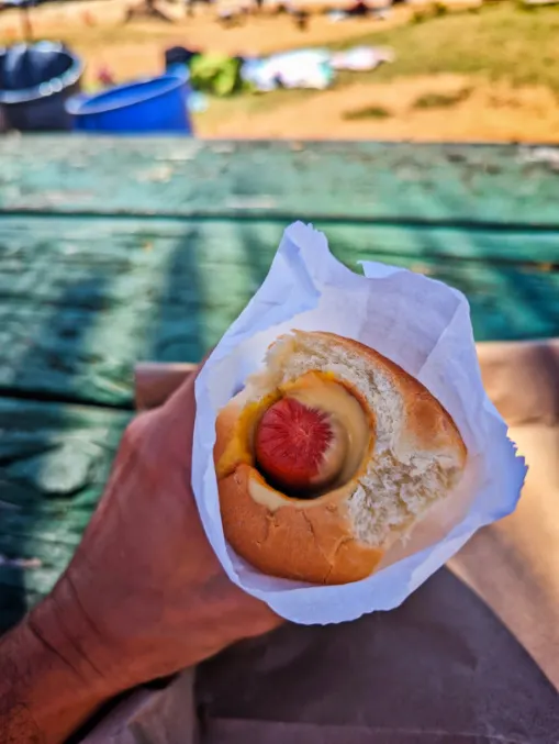 Eating Puka Dog at Poipu Koloa South Shore Kauai Hawaii 1