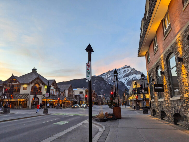 Exterior of Mount Royal Hotel with Canadian Rockies at Sunset downtown Banff Alberta 1