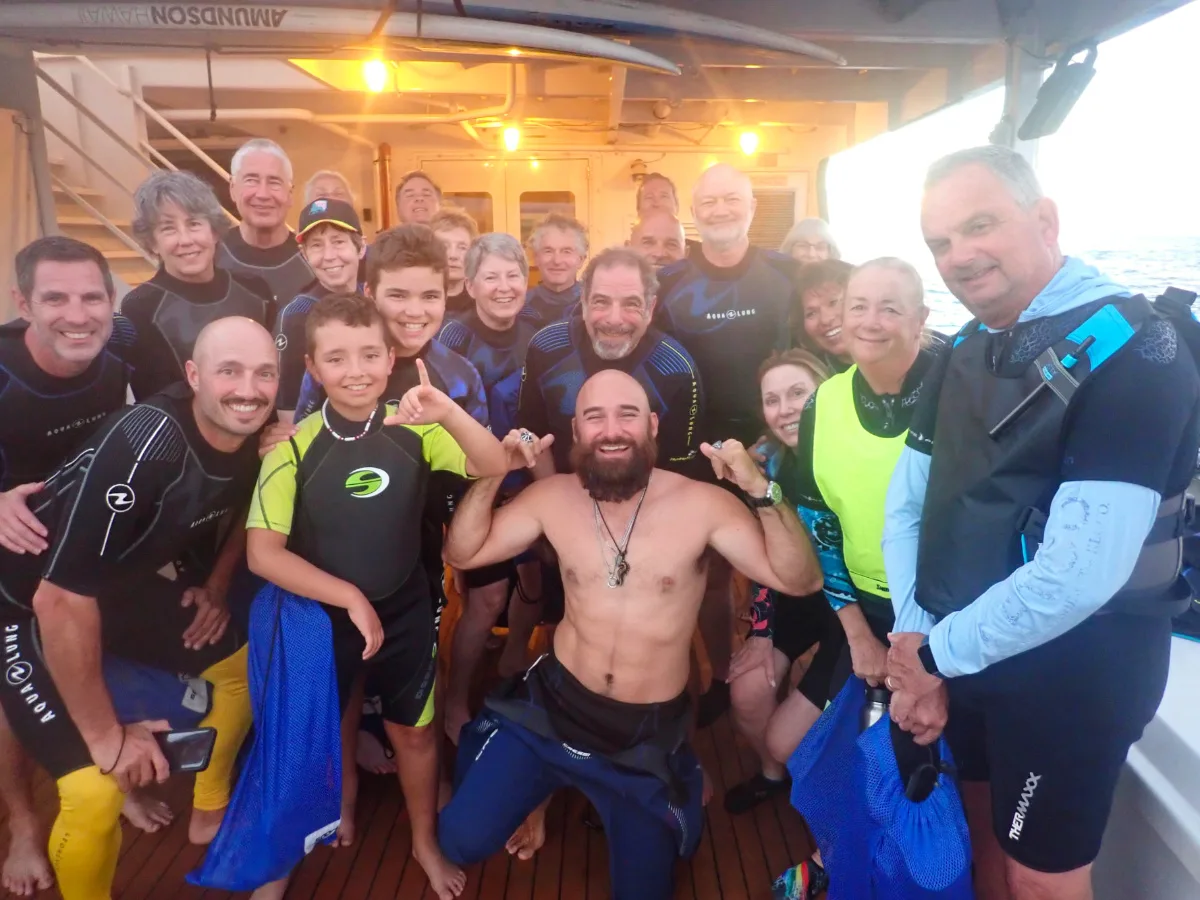 Full Taylor Family and Crew in wetsuits for manta ray snorkel on UnCruise Safari Exploerer Big Island Hawaii 1