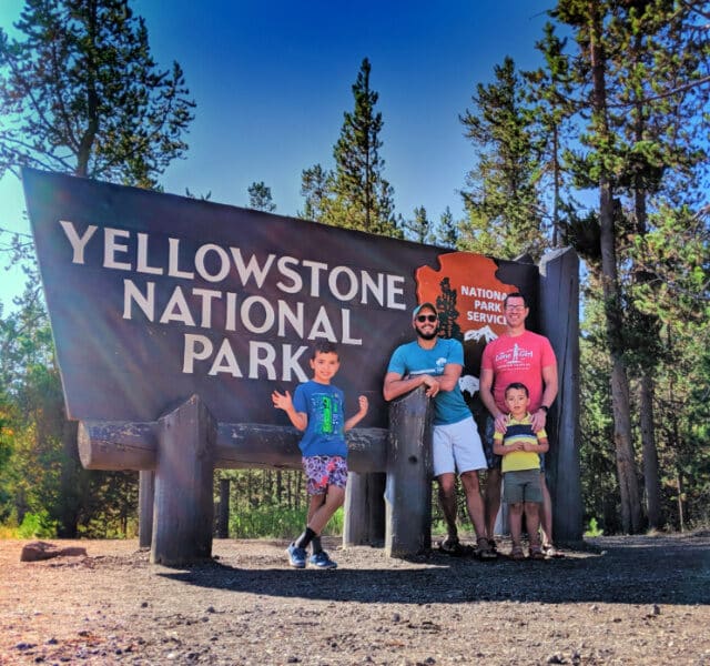 Full Taylor Family at Entrance Sign Yellowstone National Park 5