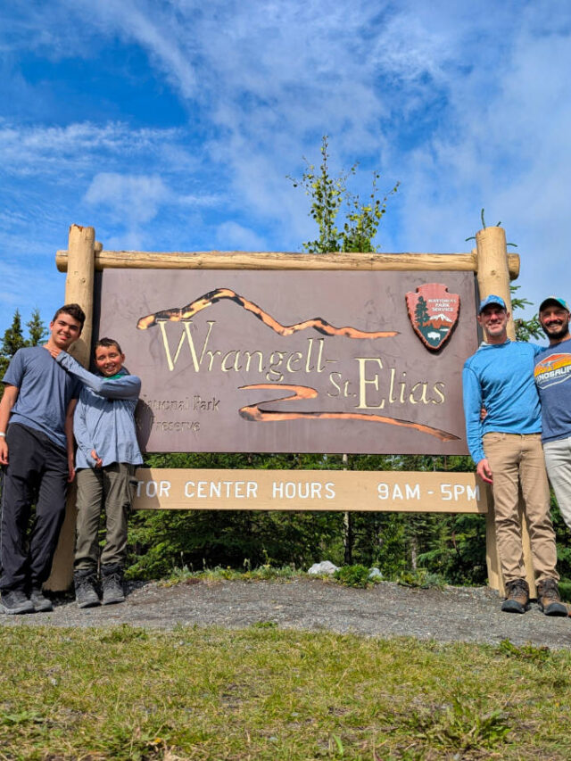 Full Taylor Family at Entrance Sign to Wrangell St Elias National Park Copper Center Alaska