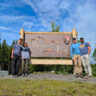 Full Taylor Family at Entrance Sign to Wrangell St Elias National Park Copper Center Alaska