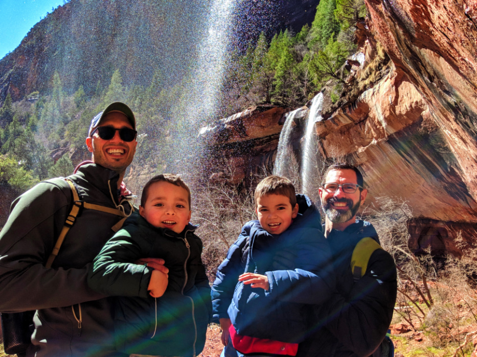 Full Taylor Family behind waterfall Emerald Pools trail Zion National Park Utah 1