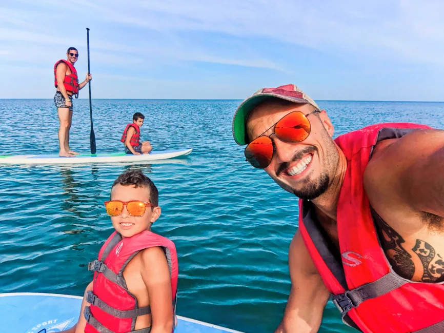 Full Taylor Family doing SUP at Beach at Naples Grande Beach Resort Naples Florida 1