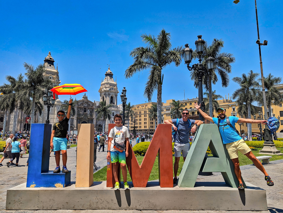 Full Taylor Family with LIMA sign Plaza Mayor Lima Peru 2