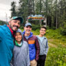 Full Taylor Family with Welcome to Valdez Sign on Richardson Highway Valdez Alaska
