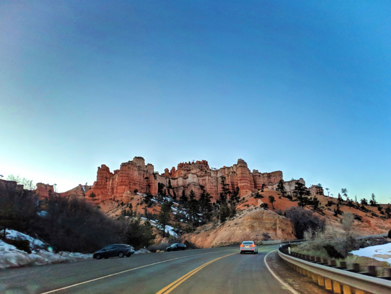 Hoodoos on highway driving in Bryce Canyon National Park Utah 2