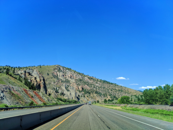 I90 driving past rocky cliffs rural Montana 2