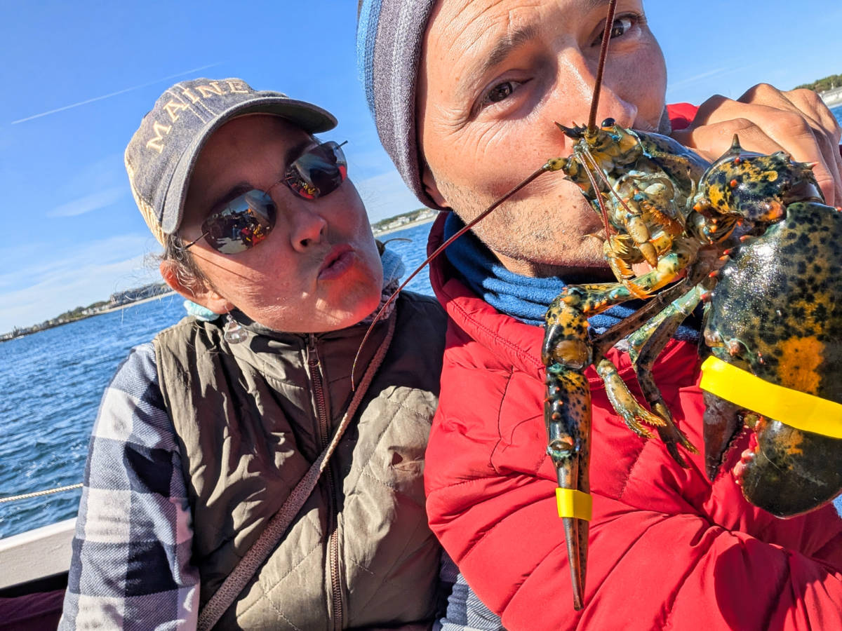 Kelly and Rob Taylor kissing Lobster on Rugosa Lobster Tour Kennebunkport Maine