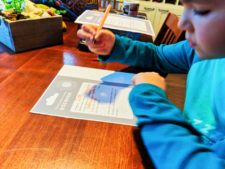 Oliver testing Ultimate Travel Journal for Kids 1