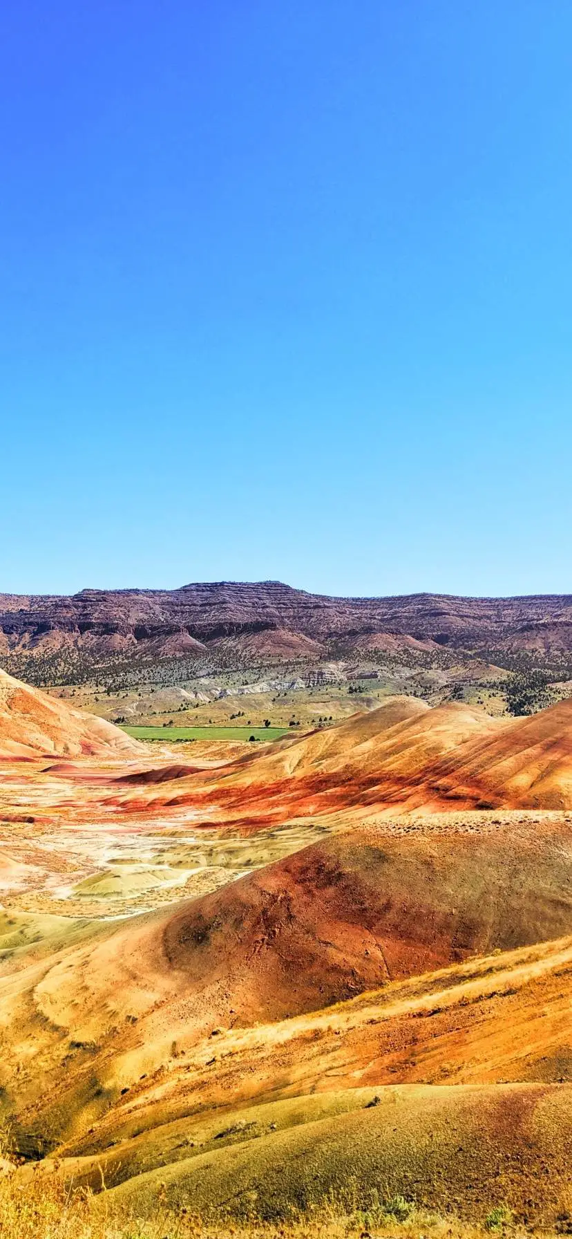 Oregon's Painted Hills are a unique natural wonder. See how to get there, when to visit, where to stay, and hiking trails at John Day Fossil Beds National Monument. Most incredible National Park in Oregon.