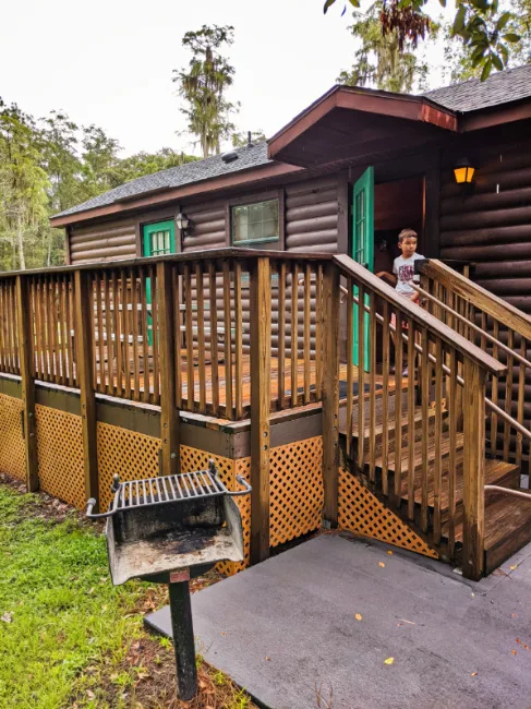 Outdoor Picnic Area with BBQ and Deck at Fort Wilderness Resort and Campground Cabin Disney World Orlando 1