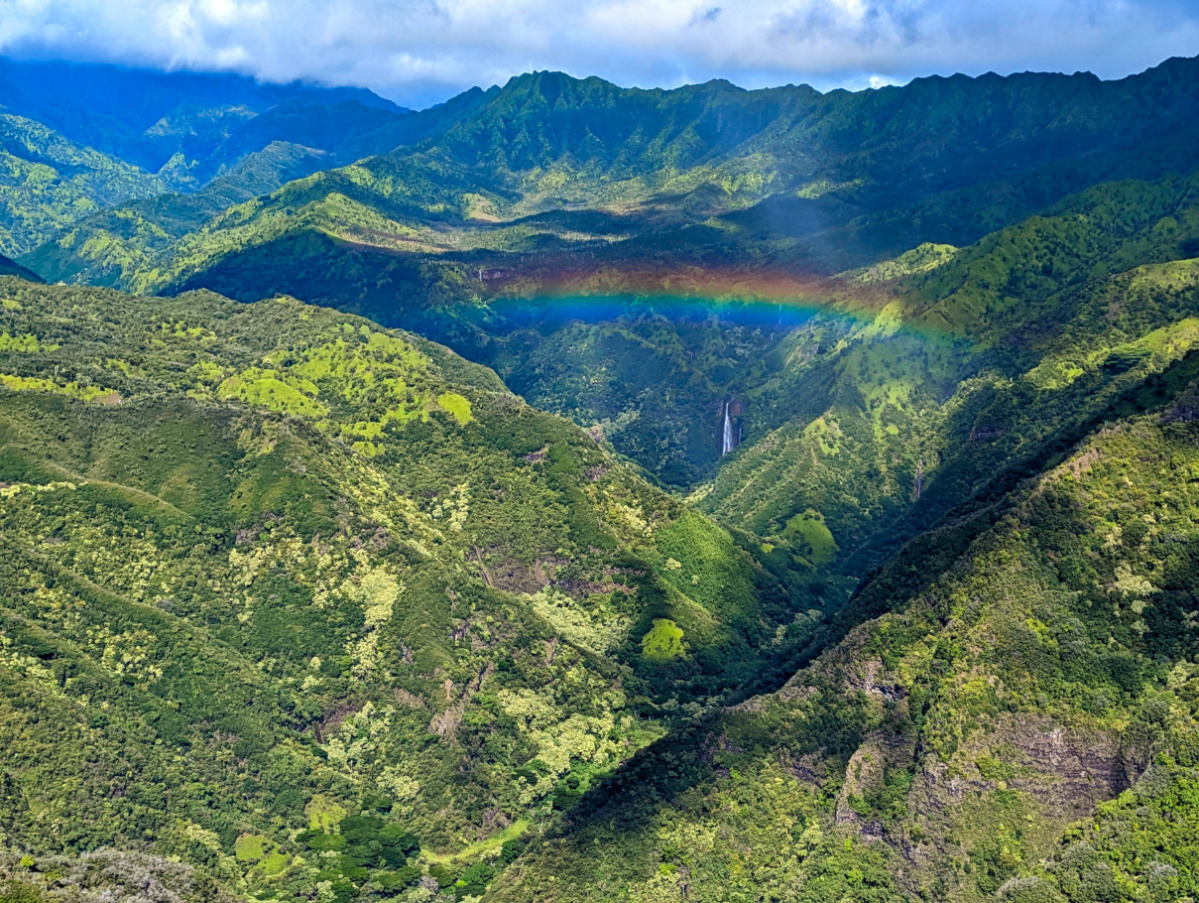 Rainbow over Jurassic Park Waterfall from Air Kauai Doors Off Helicopter Tour Kauai Hawaii 3