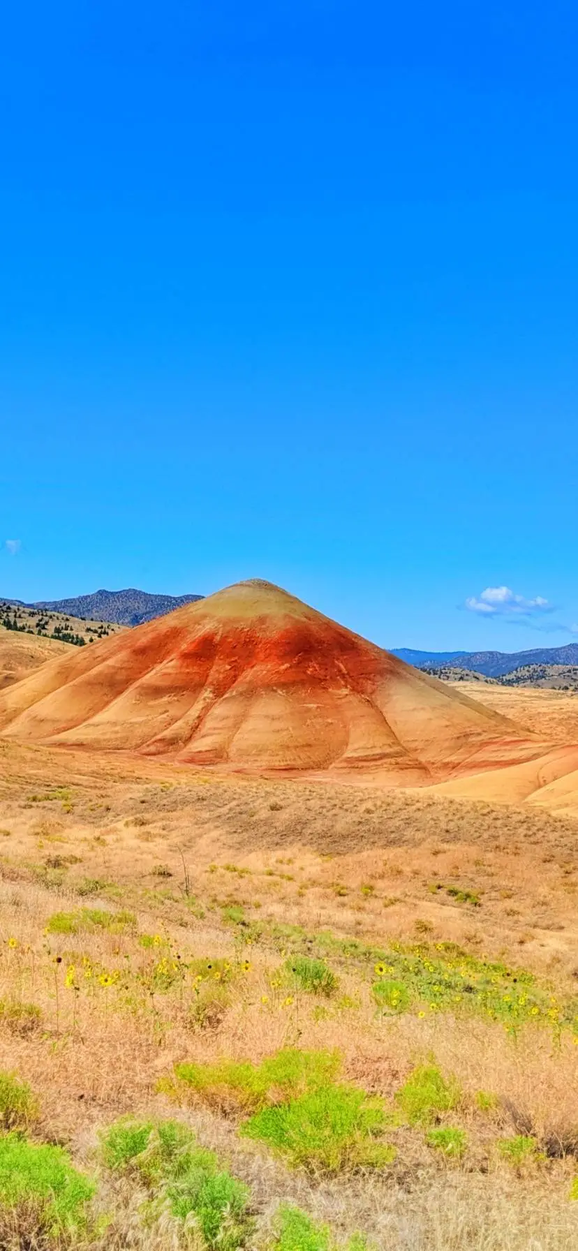 Oregon's Painted Hills are a unique natural wonder. See how to get there, when to visit, where to stay, and hiking trails at John Day Fossil Beds National Monument. Most incredible National Park in Oregon.